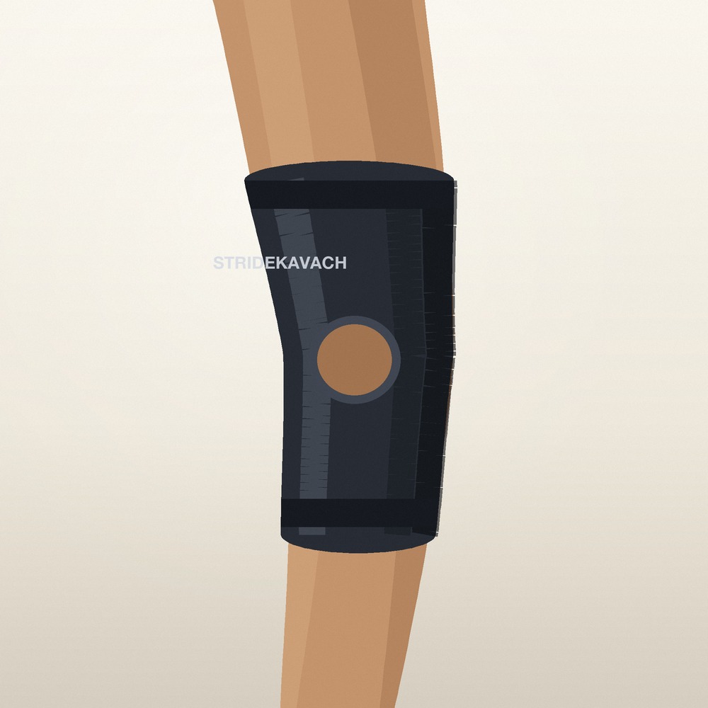 StrideKavach knee support worn on the leg, showing the open-patella opening and grip bands